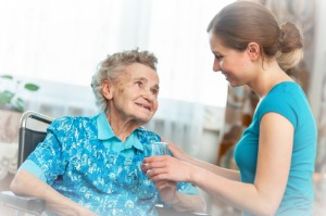 elite Senior woman with her caregiver at home